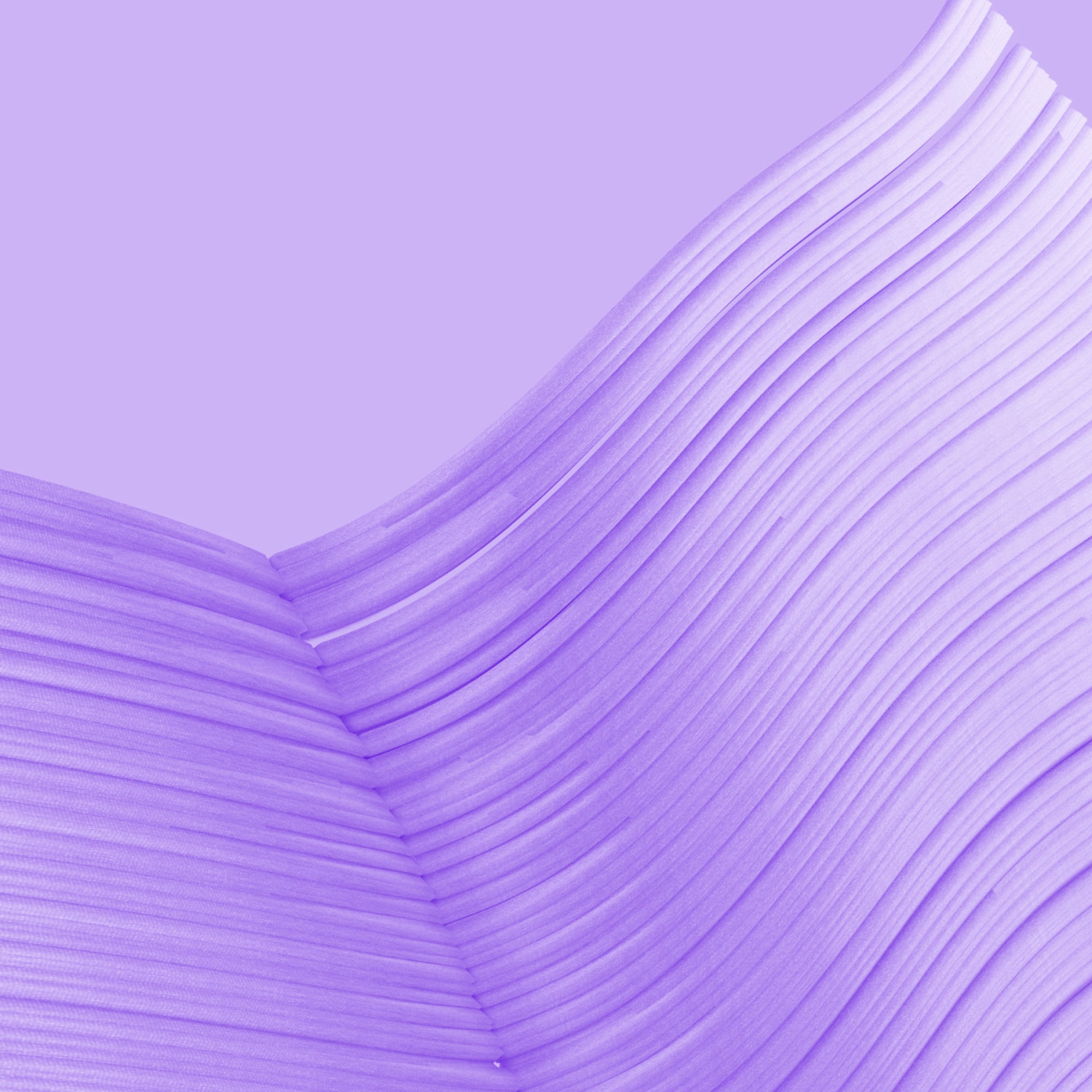close up open book pages abstract curved paper texture purple
