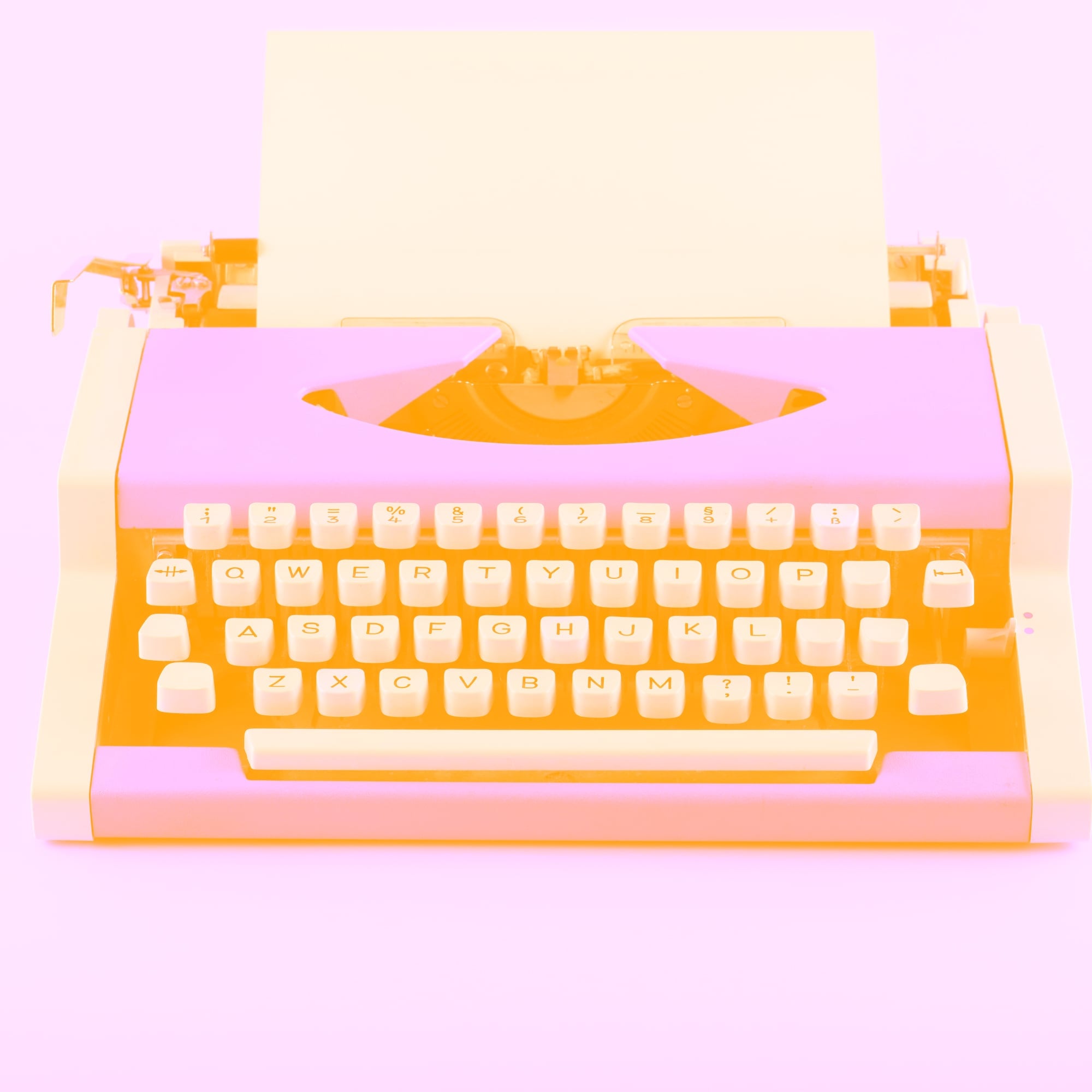 vintage retro typewriter with blank paper pink orange toned