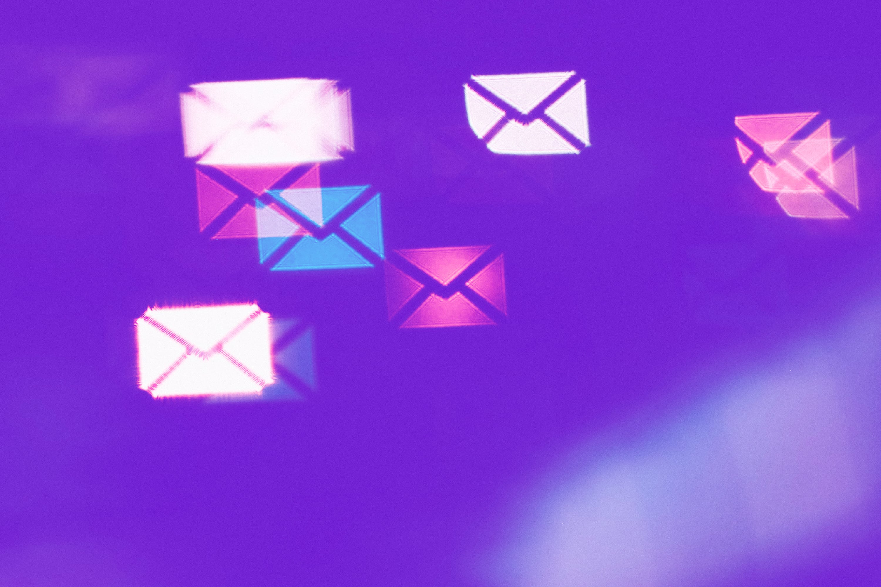 multiple email envelope icons floating purple background email marketing