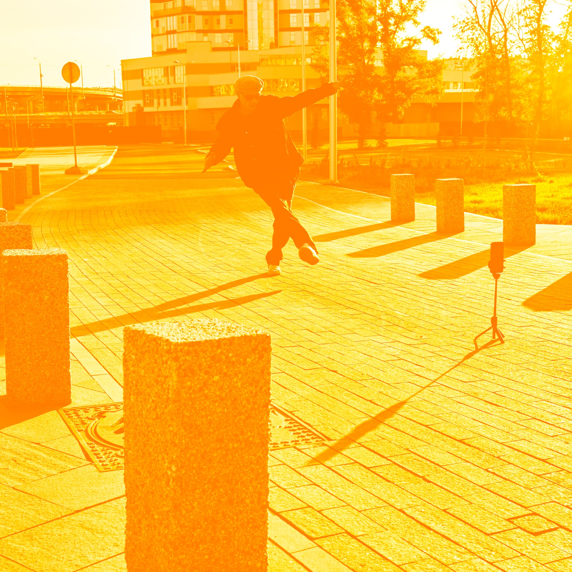 person jumping doing parkour in urban setting golden orange toned