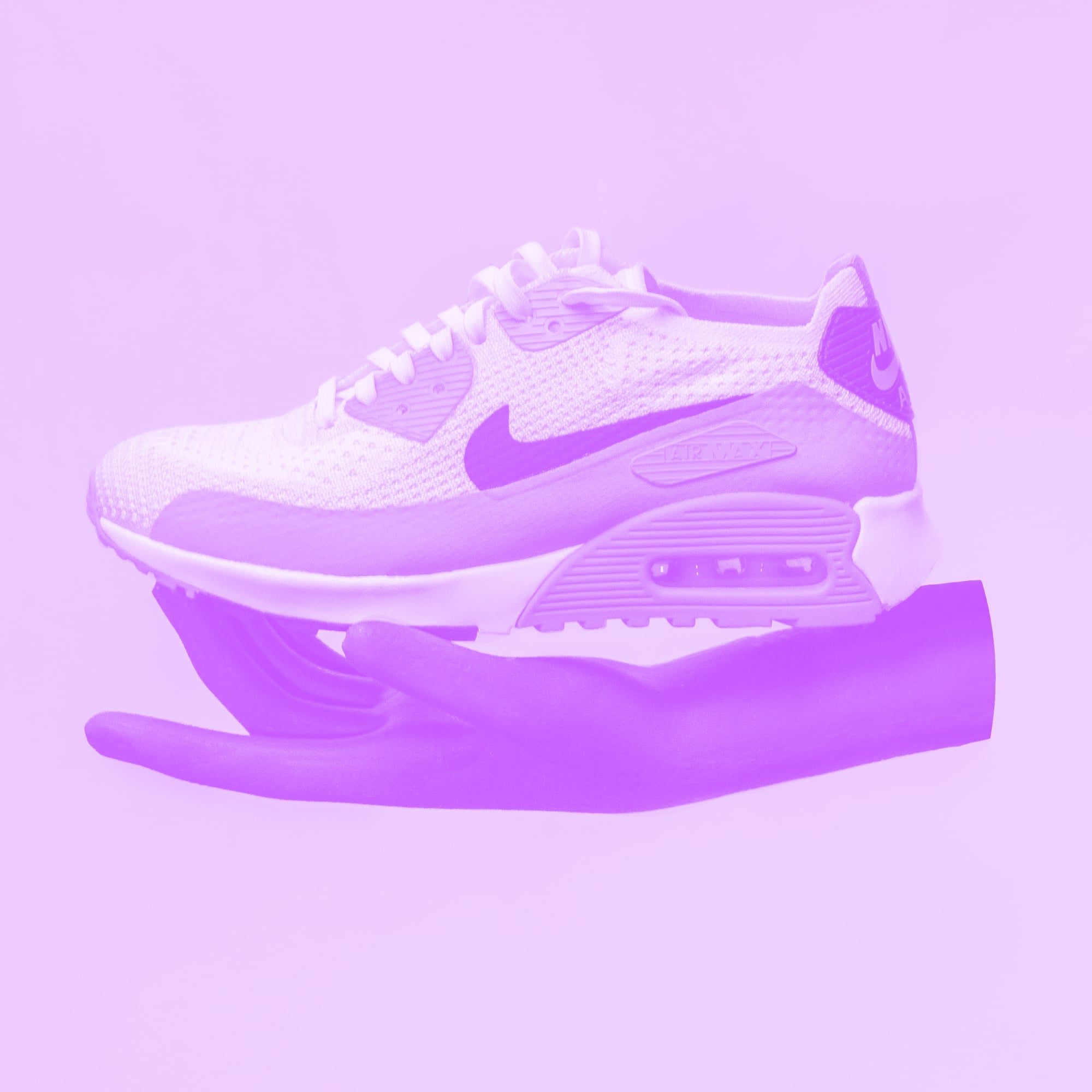 hand holding nike air max sneaker purple toned product shot