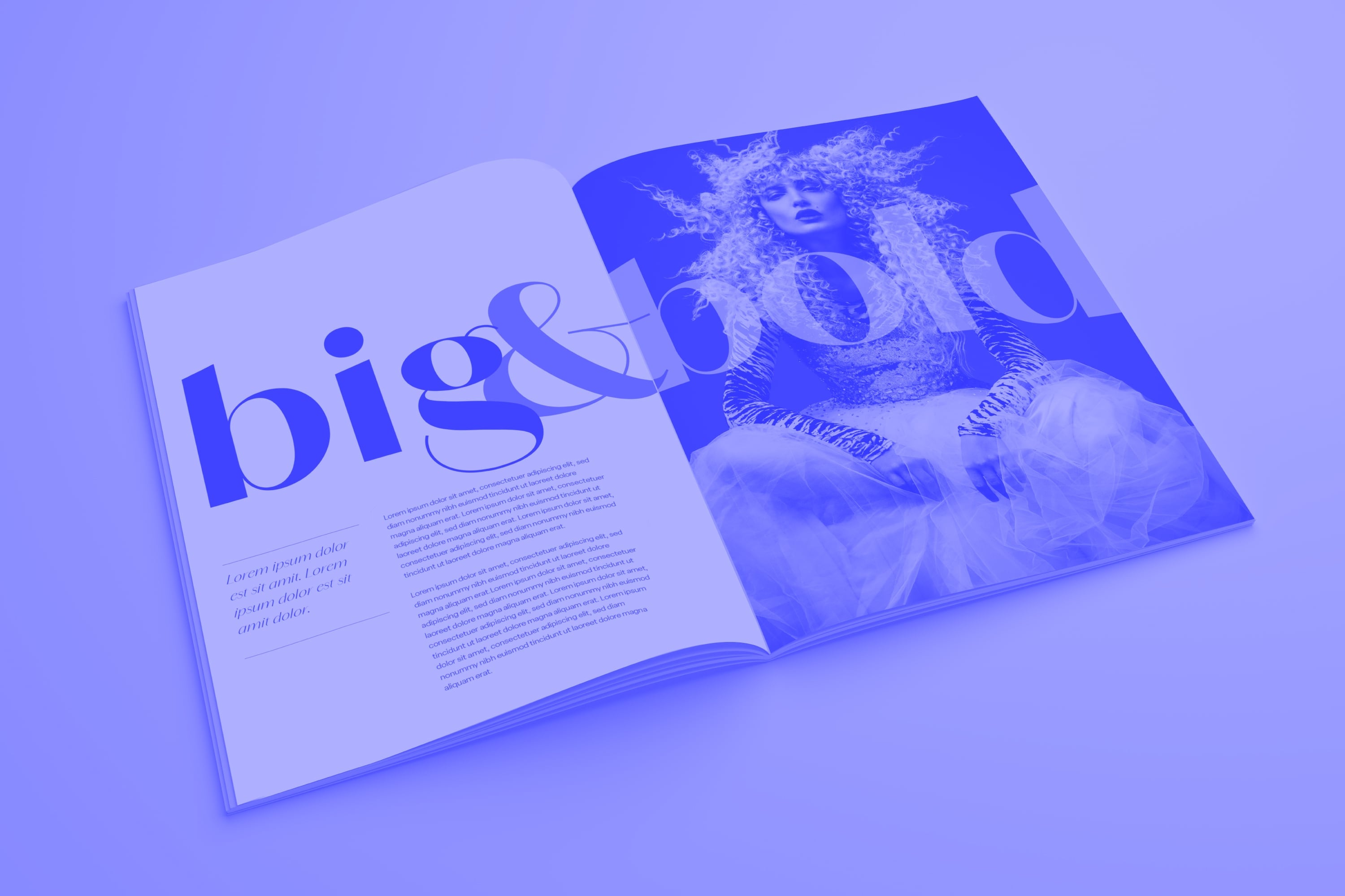 open big and bold fashion magazine showing editorial spread with model blue toned