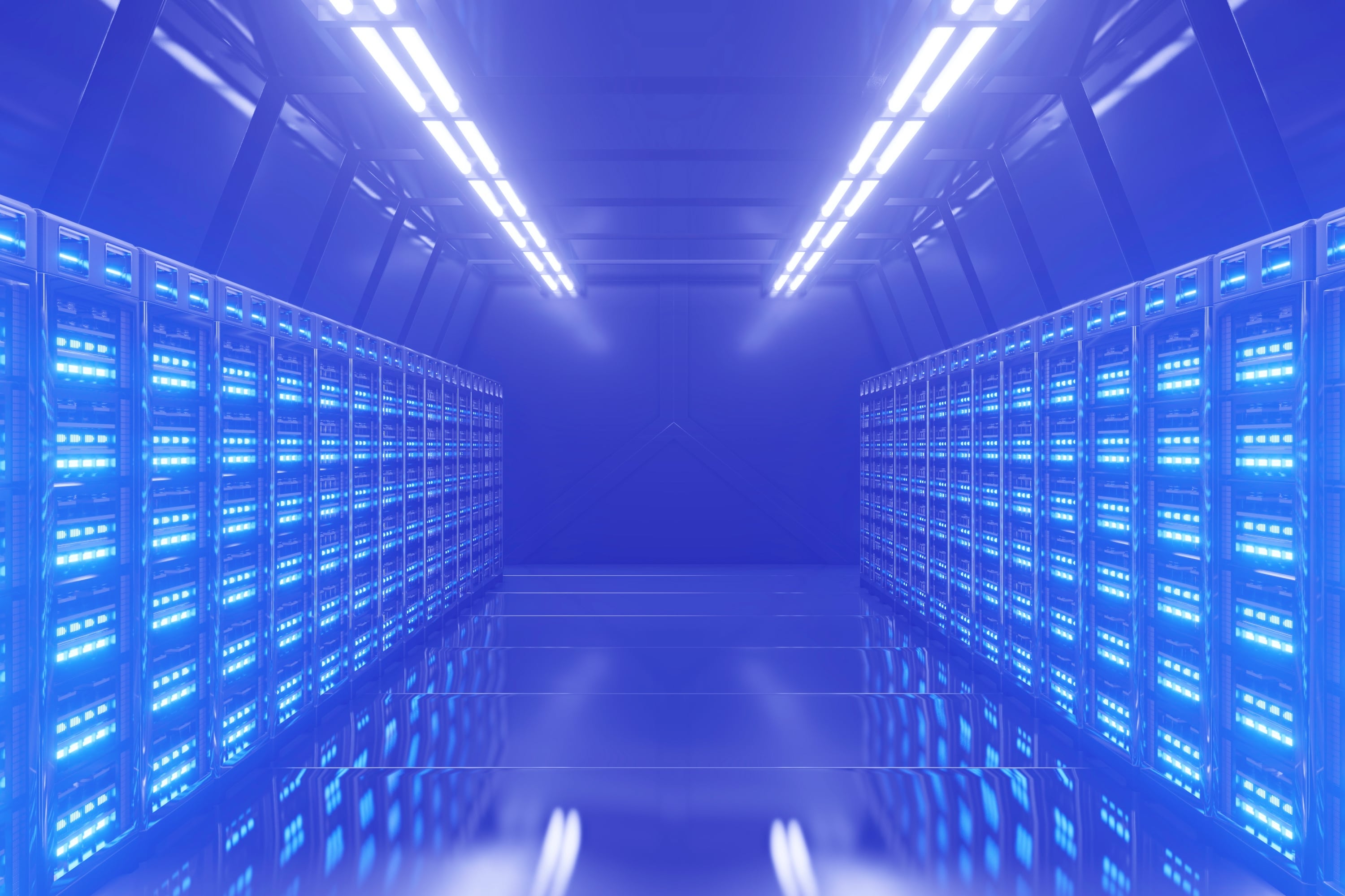 data centre server room corridor with illuminated server racks blue toned