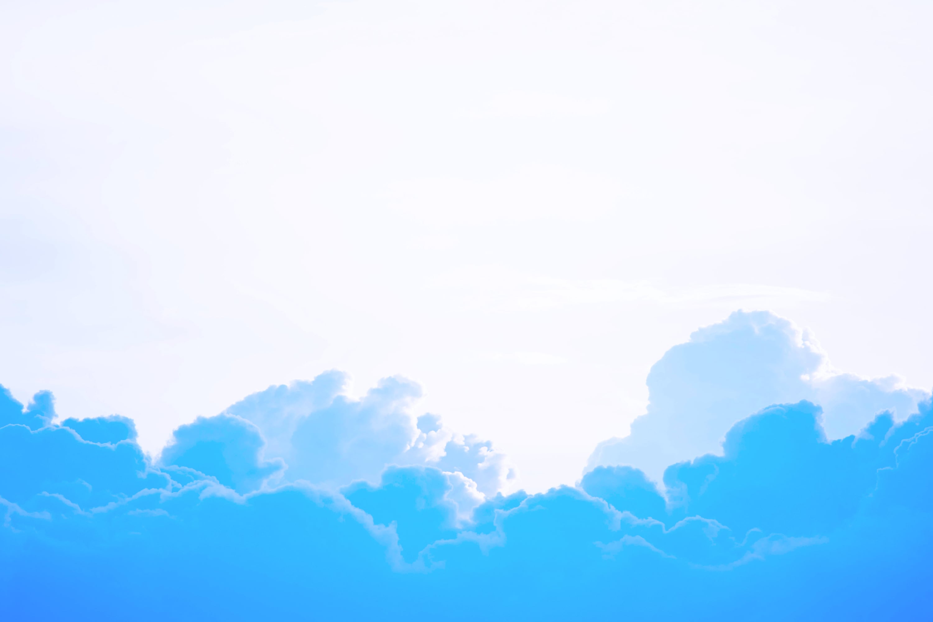white fluffy clouds against bright blue sky cloud hosting concept
