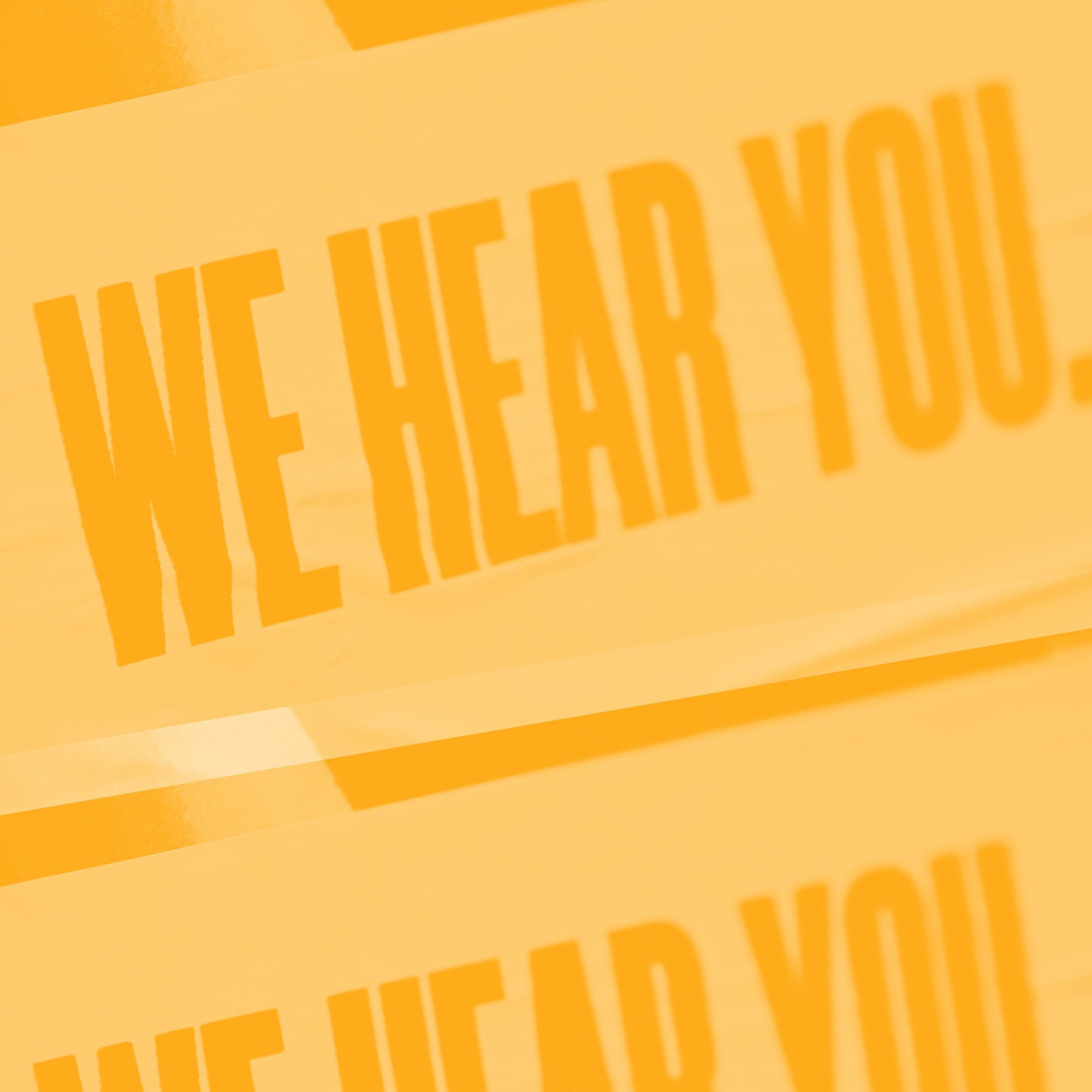 bold orange we hear you text typography on amber background customer support