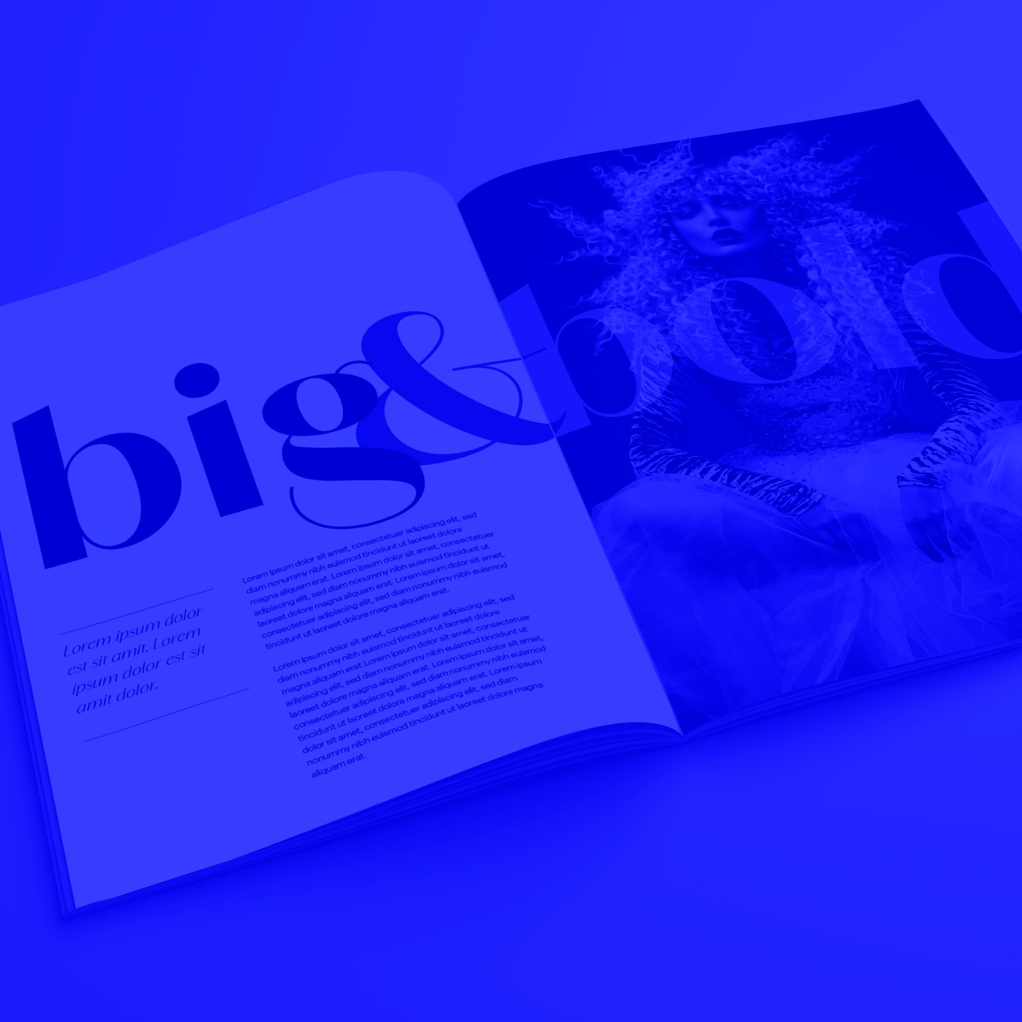 open big and bold fashion magazine editorial spread with model blue toned