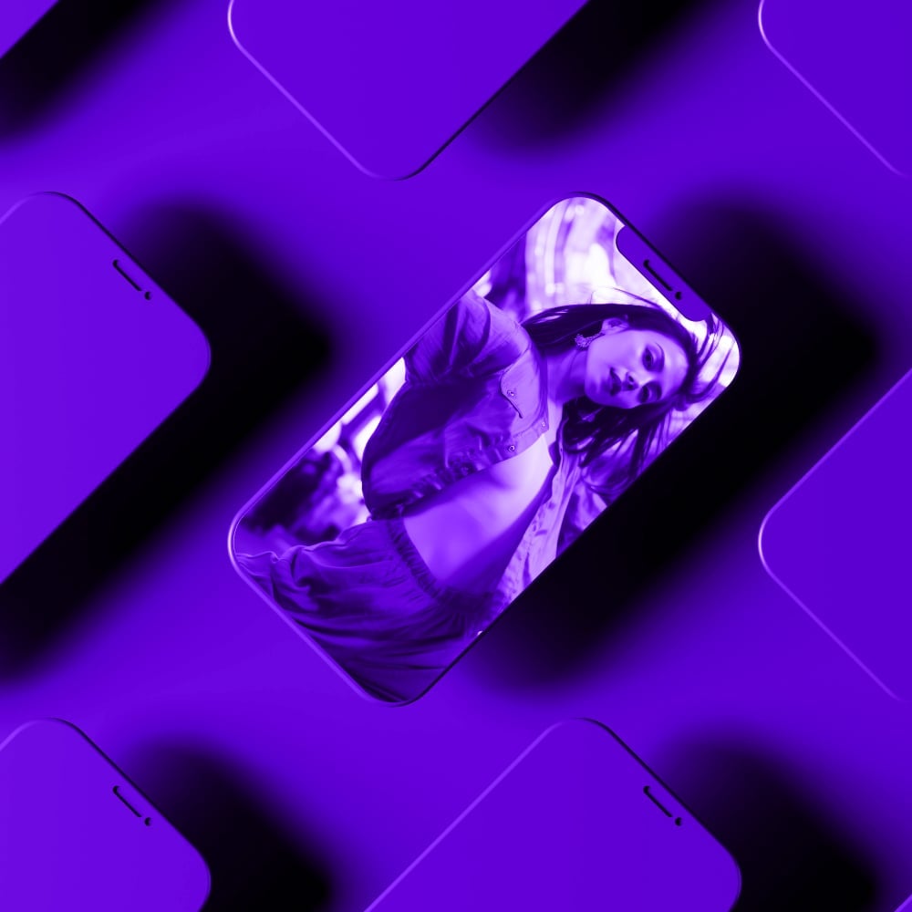 multiple iphone mockups in diagonal repeating pattern with woman dancing on screen purple