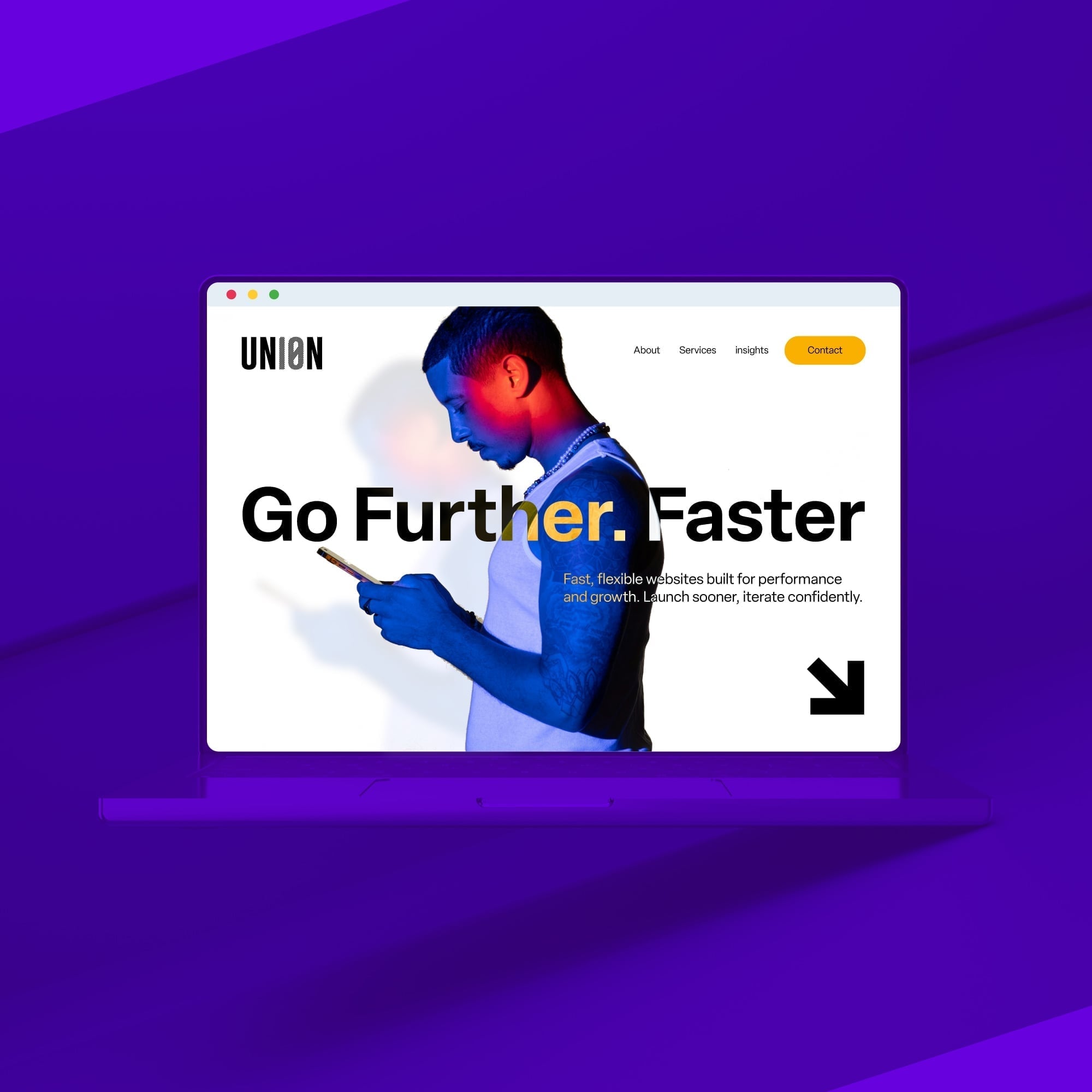 laptop showing completed union website with scroll arrow purple background