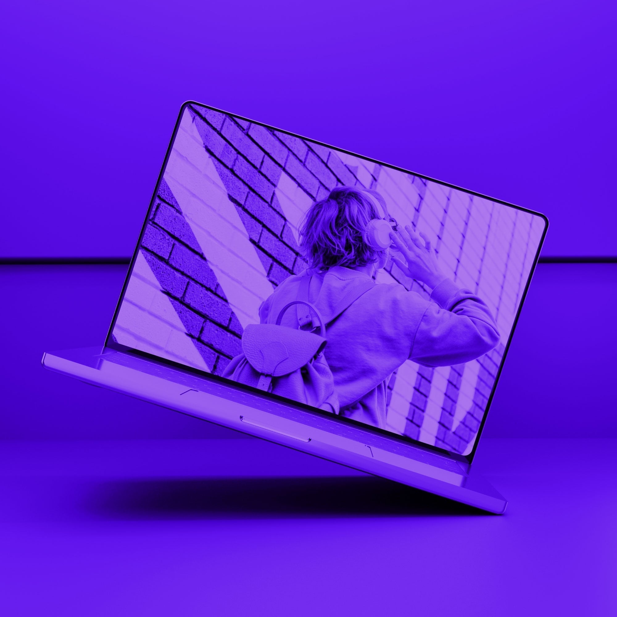 floating laptop screen showing person with headphones and backpack purple toned