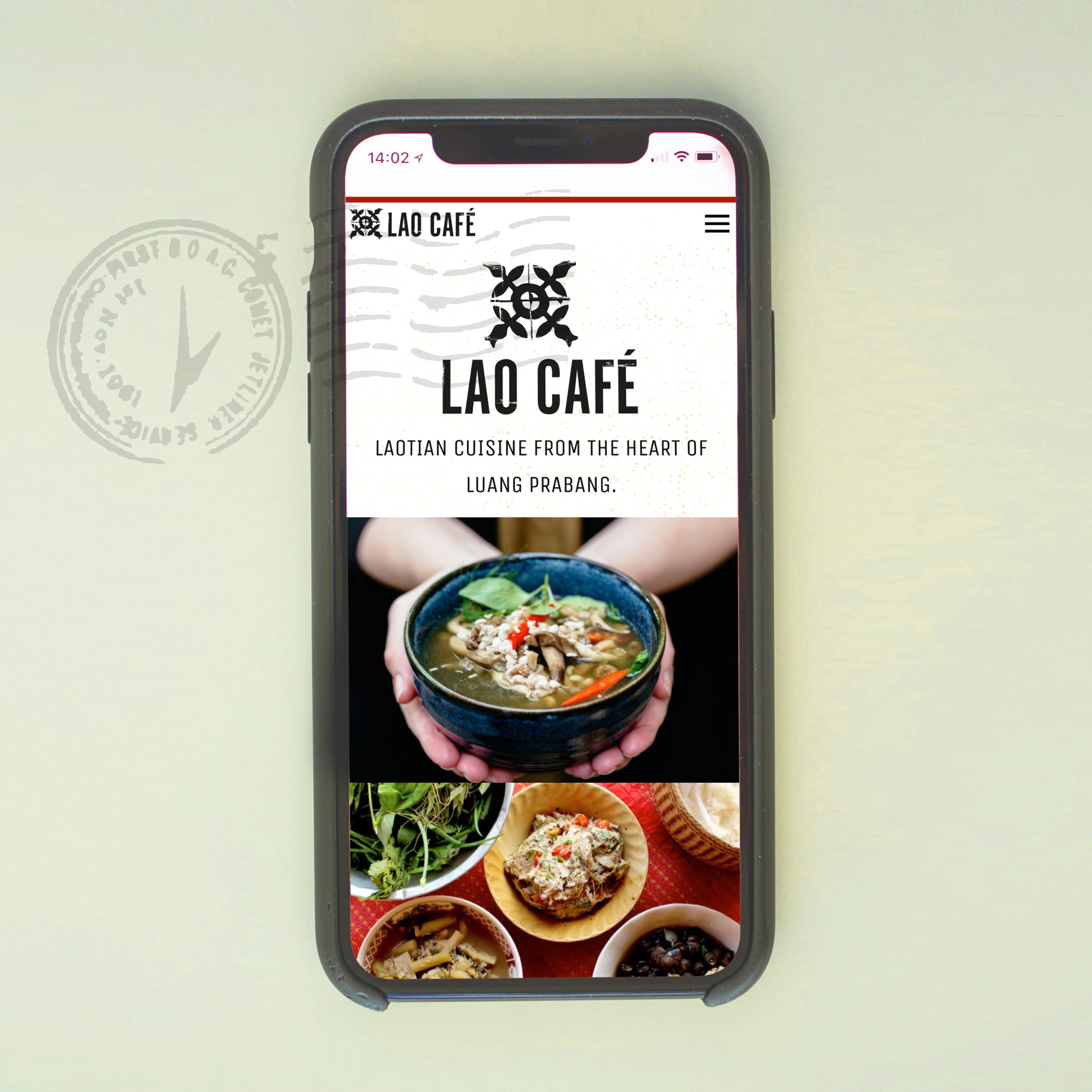 Lao Café one-page website displayed on a smartphone with logo header and food photography