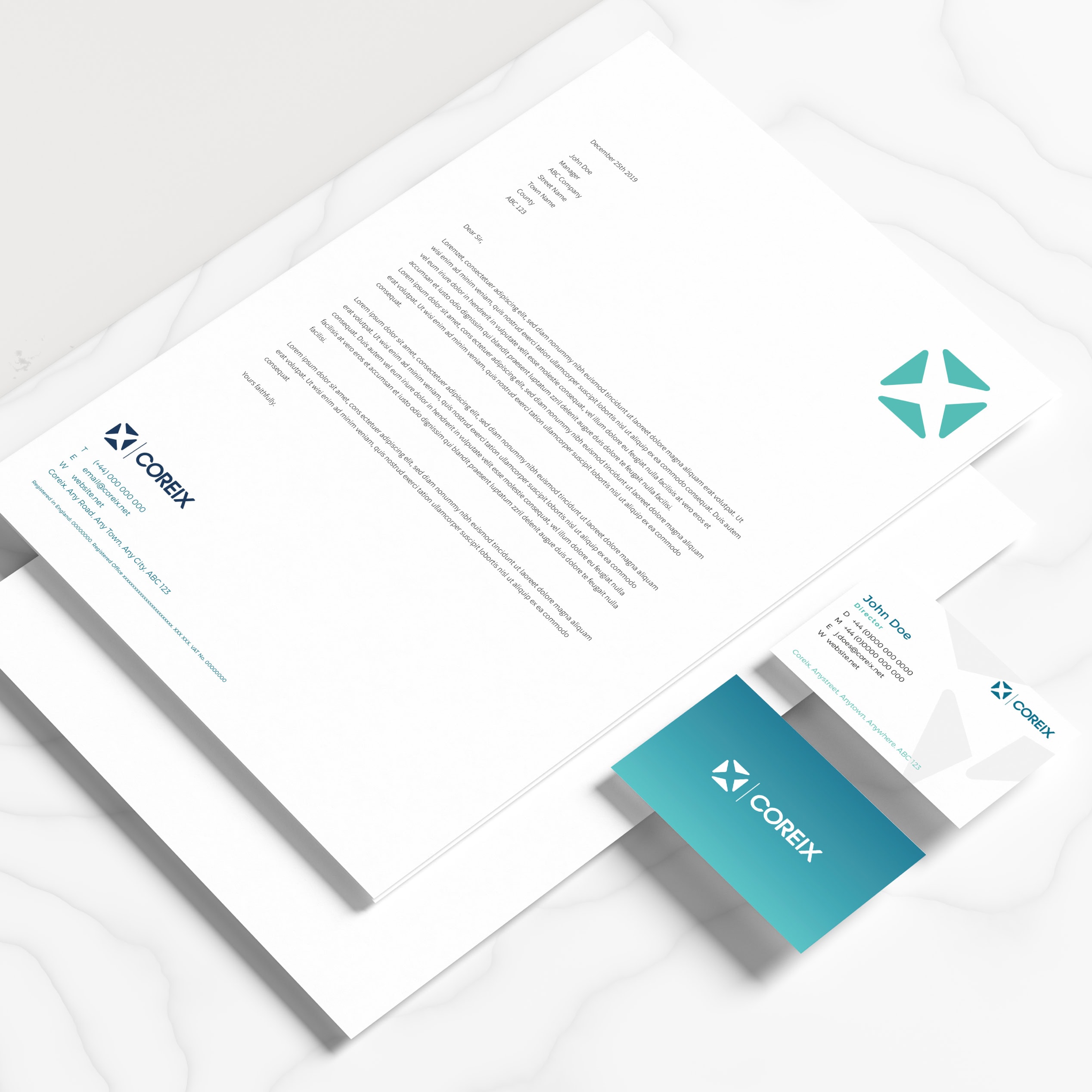 Coreix stationery set showing letterhead and business card mockups.