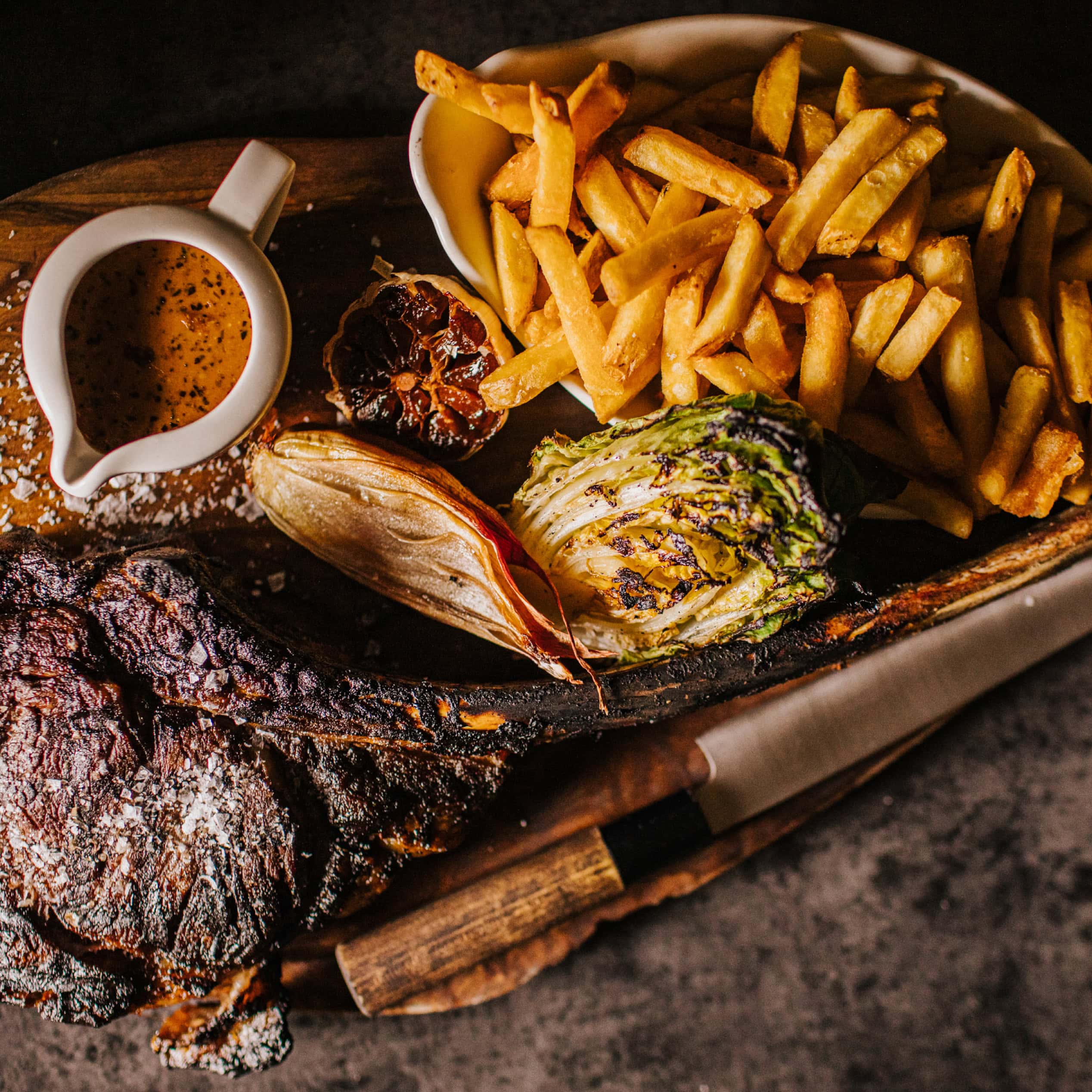 Food photography featuring steak, chips and gravy