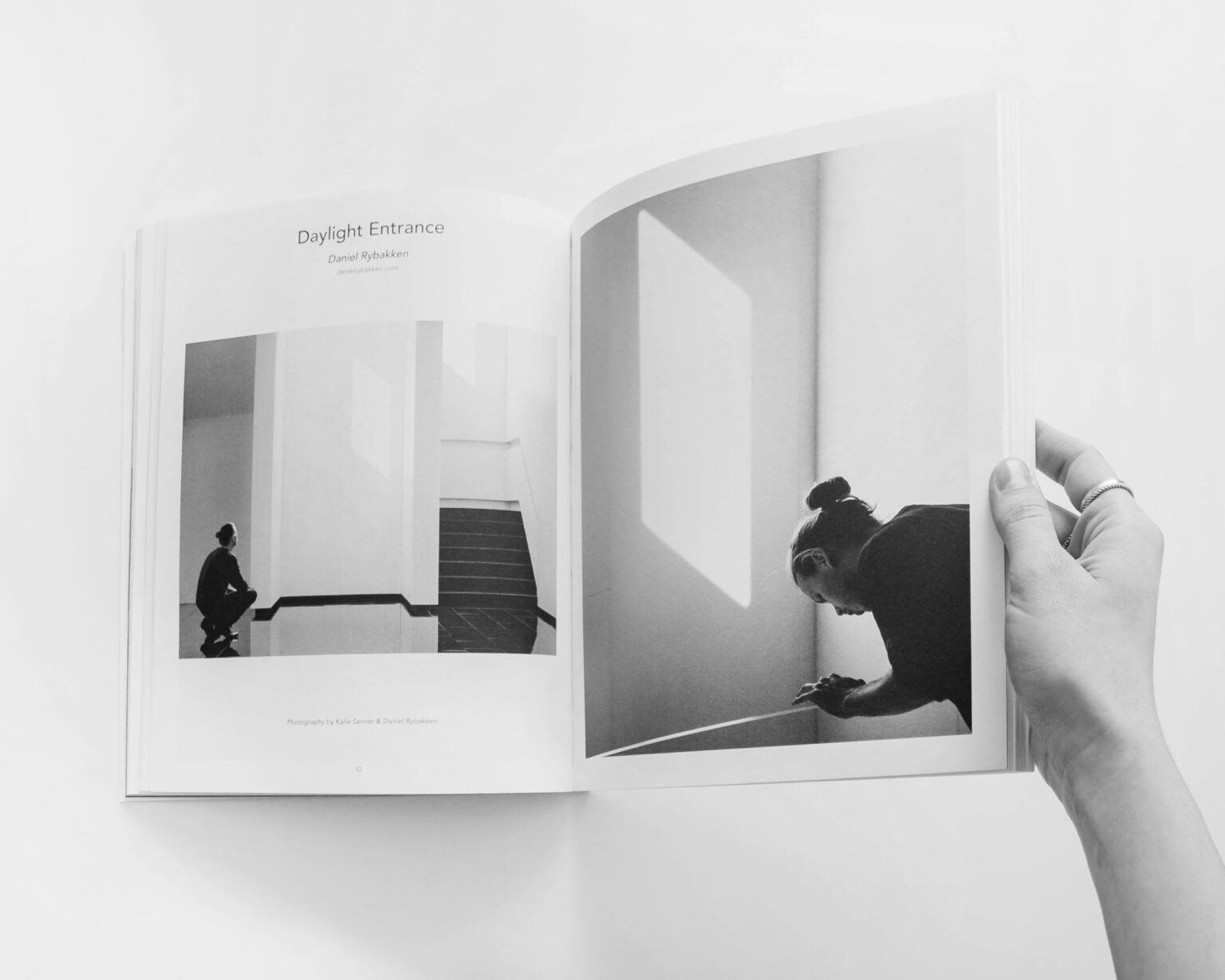 Woman's hand turning the pages of a brochure